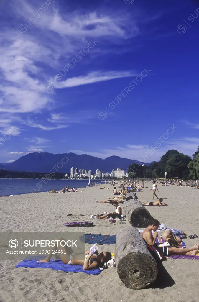 People sun tanning on Kitsilano Beach, English Bay, Vancouver, British Columbia, Canada