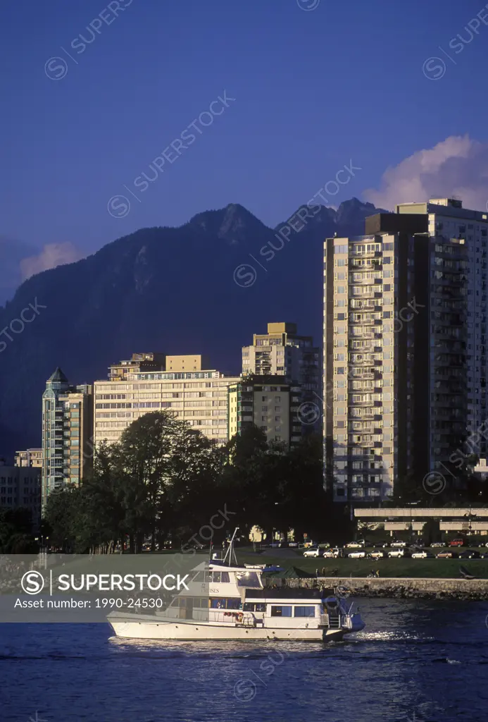 View across English Bay to West End condos with yacht, Vancouver, British Columbia, Canada