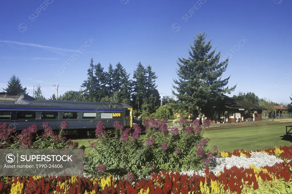 Qualicum Beach, E & N railway station with train arriving, Vancouver Island, British Columbia, Canada