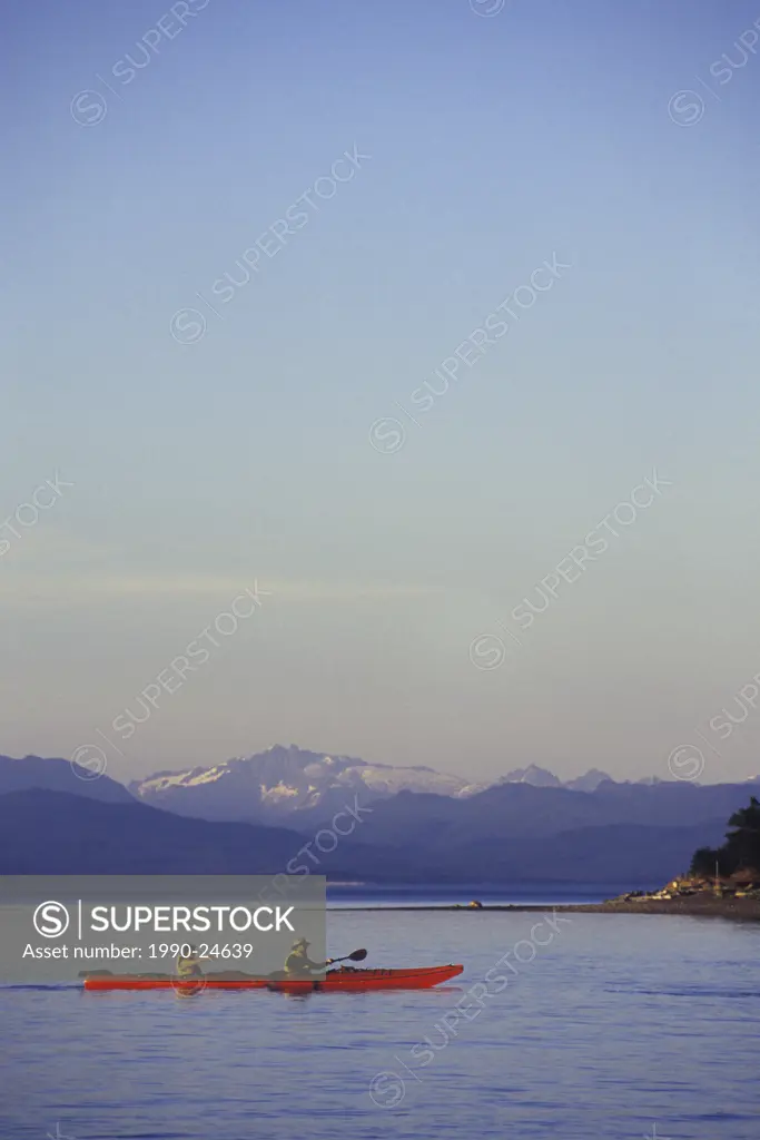 Parksville Beach Double kayak paddles on Georgia Strait  Coast Range in distance in evening, Vancouver Island, British Columbia, Canada