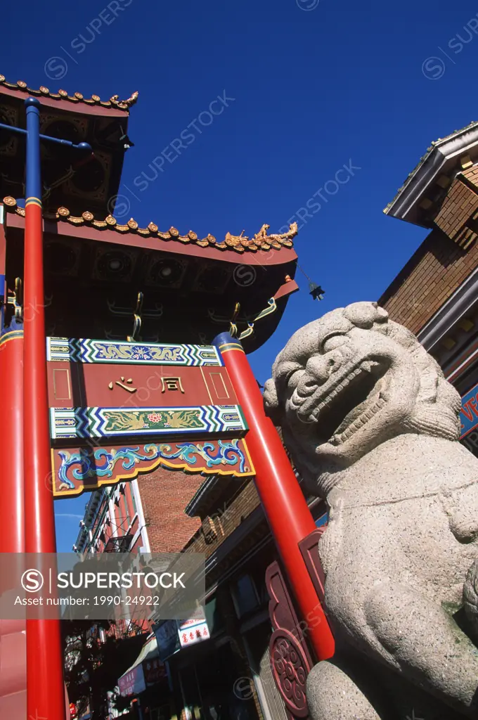 Statue and gate of Harmonius Interest in China Town, Victoria, Vancouver Island, British Columbia, Canada