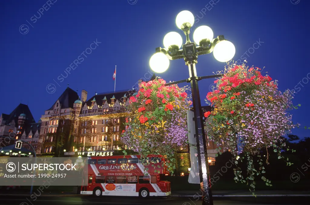 Empress Hotel with flower baskets in the foreground at twilight, Victoria, Vancouver Island, British Columbia, Canada