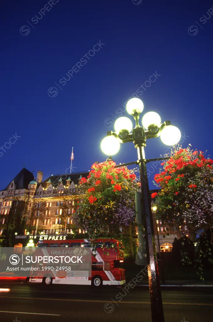 Empress Hotel with flower baskets in the foreground at twilight, Victoria, Vancouver Island, British Columbia, Canada