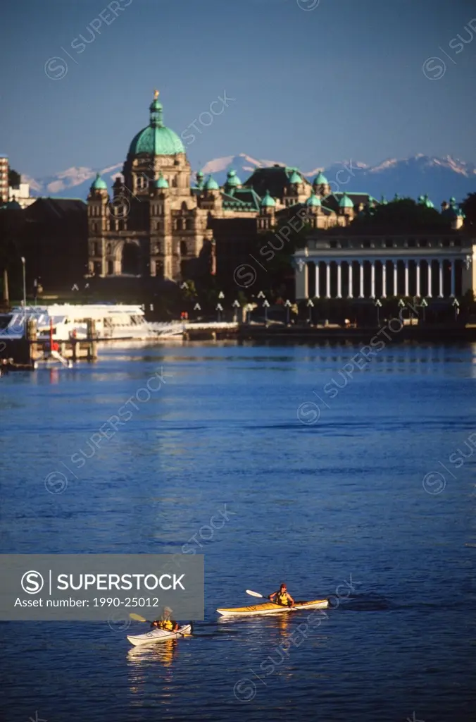 kayakers in the inner harbour with the Parliament Buildings beyond, Victoria, Vancouver Island, British Columbia, Canada