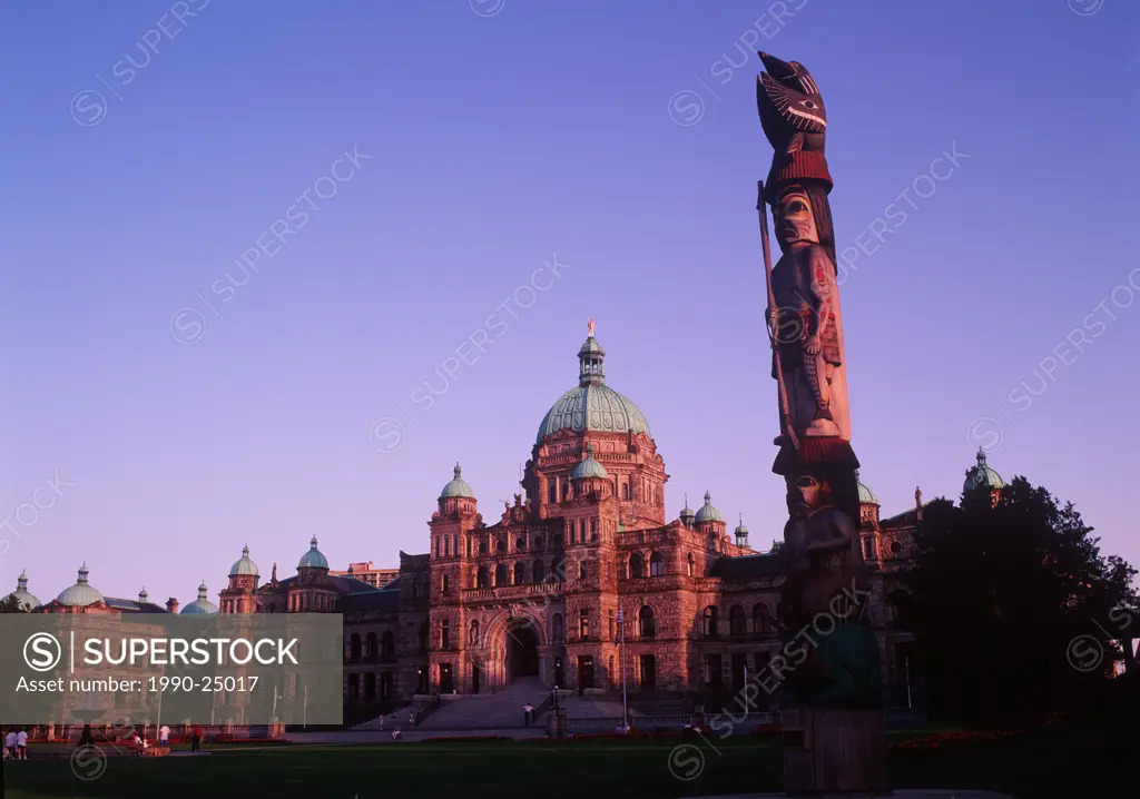 Totem Pole with Parliament Building beyond, Victoria, Vancouver Island, British Columbia, Canada