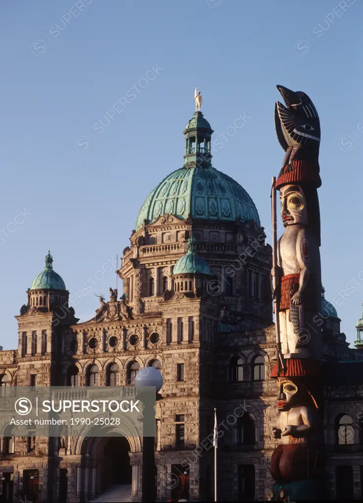 Totem Pole with Parliament Building beyond, Victoria, Vancouver Island, British Columbia, Canada