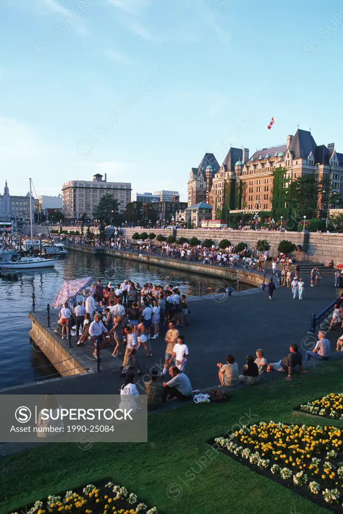Inner Harbour causeway crowded with people, Victoria, Vancouver Island, British Columbia, Canada