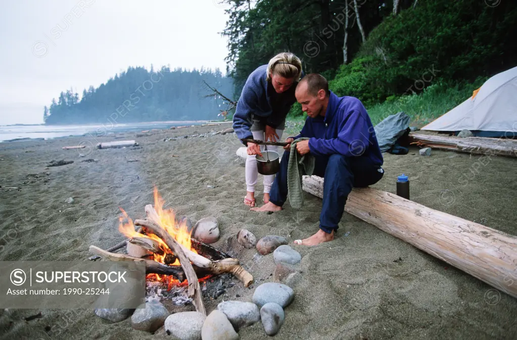 West Coast Trail - campers with fire at Darling River, Vancouver Island, British Columbia, Canada