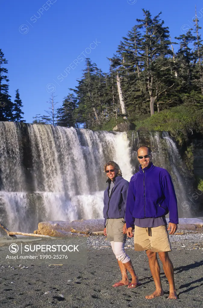 Pacific Rim National Park, West Coast Trail - hikers at Tsusiat Falls, Vancouver Island, British Columbia, Canada