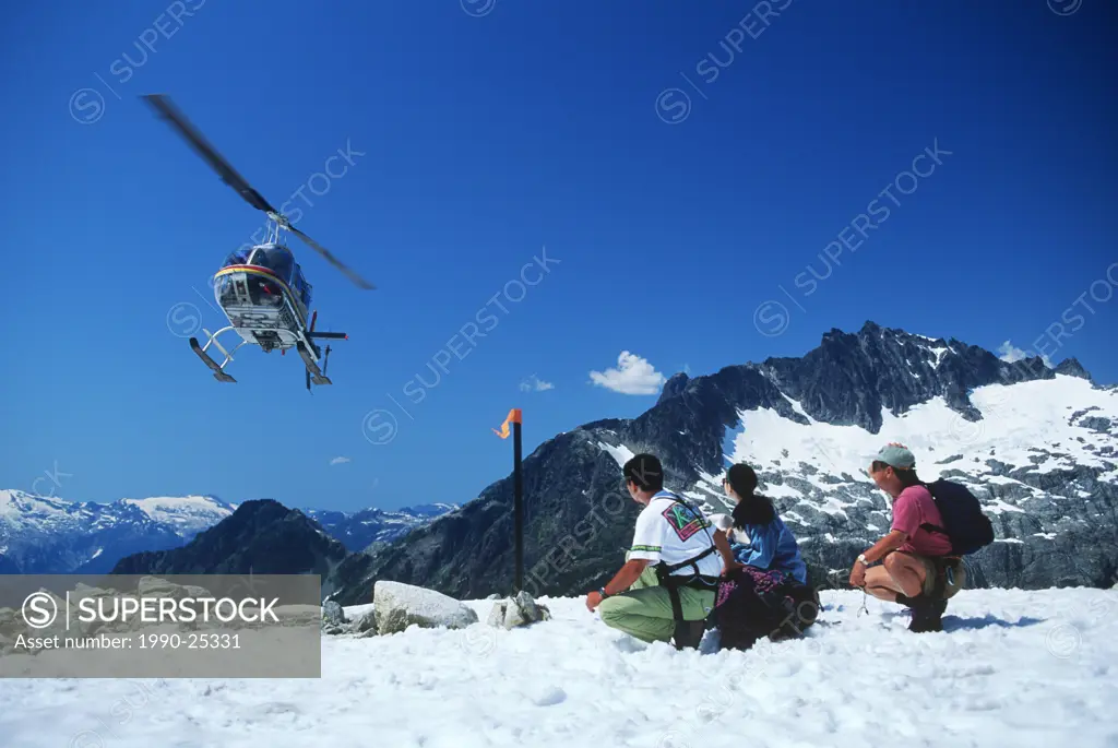 Japanese tourists heli hiking in Tantalus Range, Whistler, British Columbia, Canada