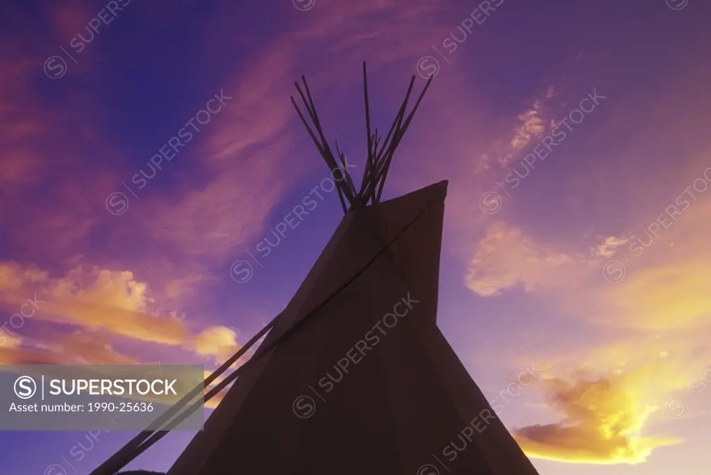 First Nations Tipi village above the Fraser River at twilight, British Columbia, Canada