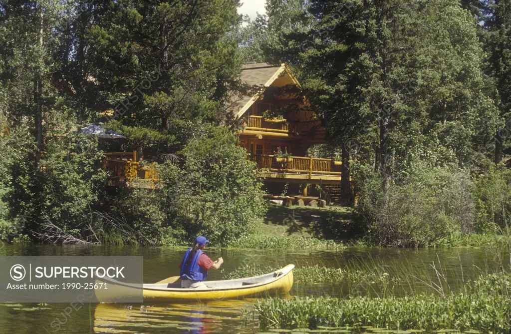 Canoeing past Ten-ee-ah Lodge, Spout Lake, Cariboo Country, British Columbia, Canada