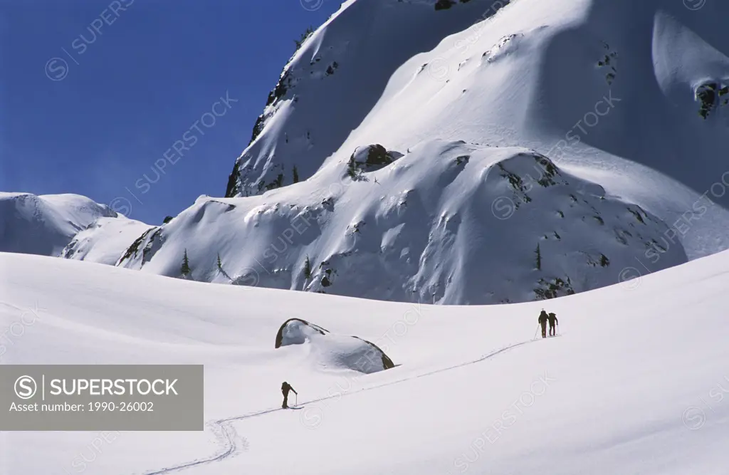 Skiers approach Cloudburst Mountain, north of Squamish, British Columbia, Canada