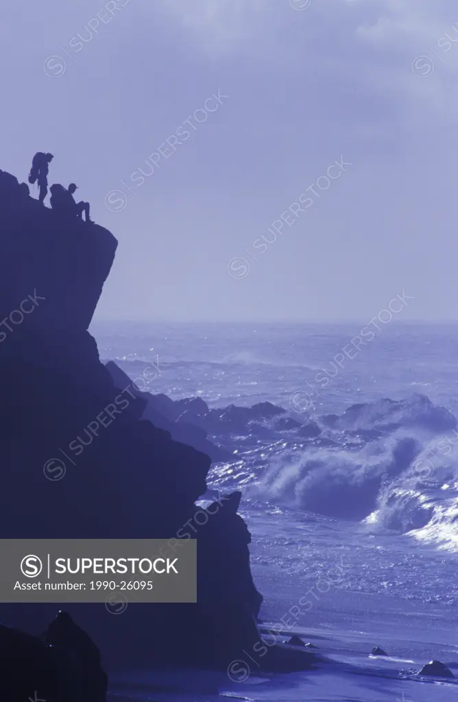 Hikers on Rock ledge, West Coast Trail, Pacific Rim National Park, Vancouver Island, British Columbia, Canada