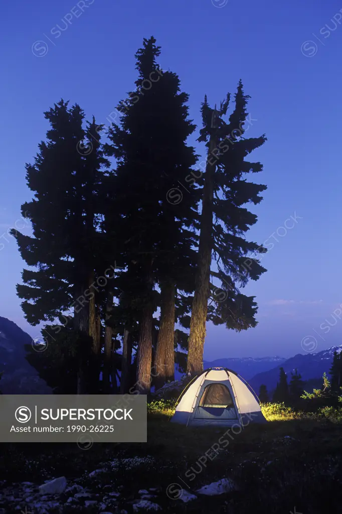 Illuminated tent at night, Tantalus Range, British Columbia, Canada