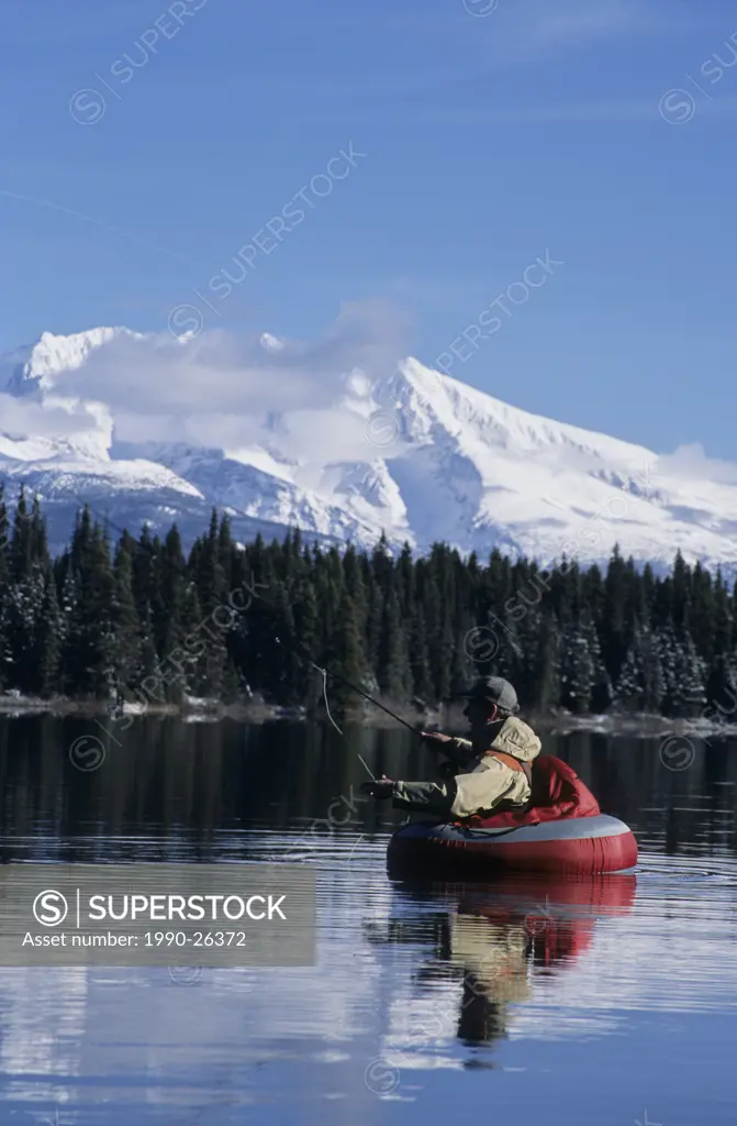 Flyfishing from float tube, McDonnell Lake, British Columbia, Canada