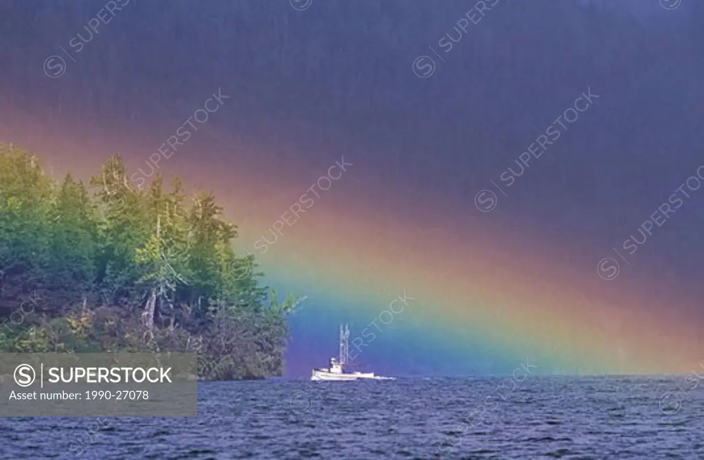 Salmon troller under rainbow in Clayoquot Sound, Vancouver Island, British Columbia, Canada
