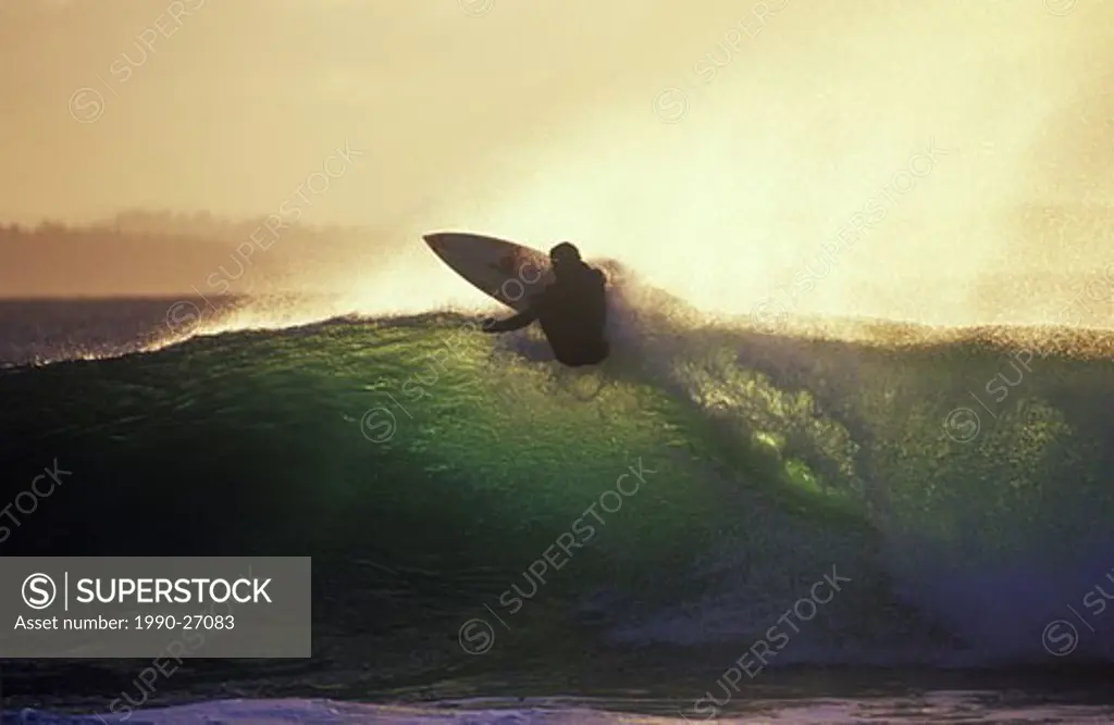 Surfer in early morning, near Tofino, Vancouver Island, British Columbia, Canada