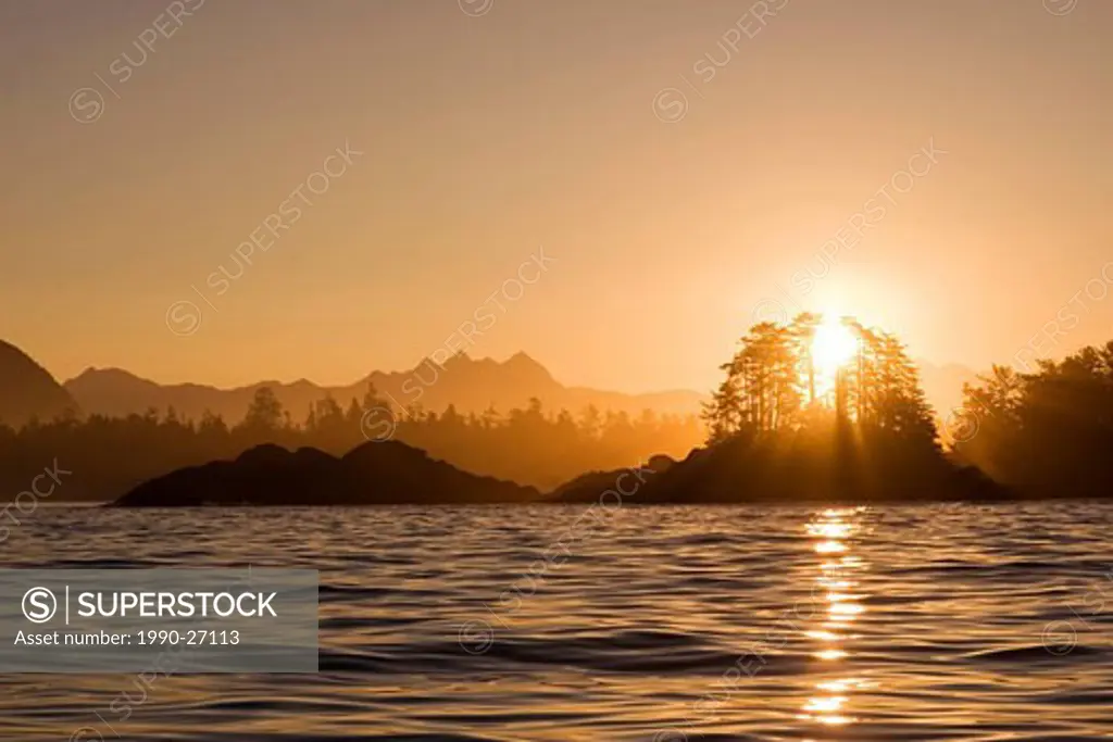 sunrise through Frank Island, near Tofino, Vanocuver Island, British Columbia, Canada