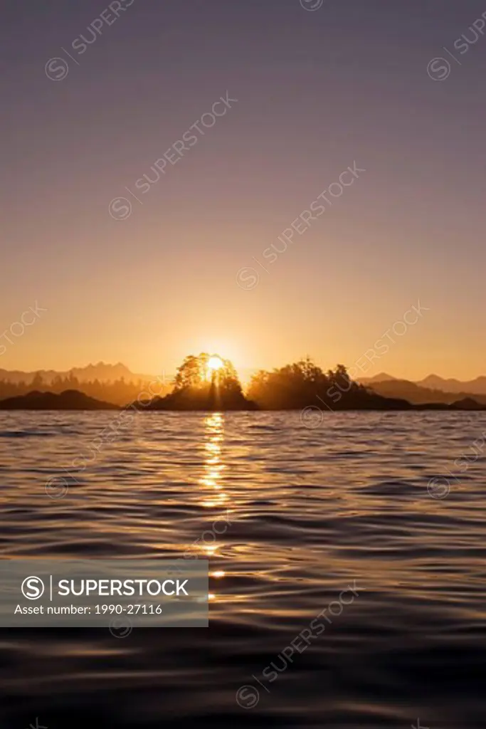 sunrise through Frank Island, near Tofino, Vancouver Island, British Columbia, Canada
