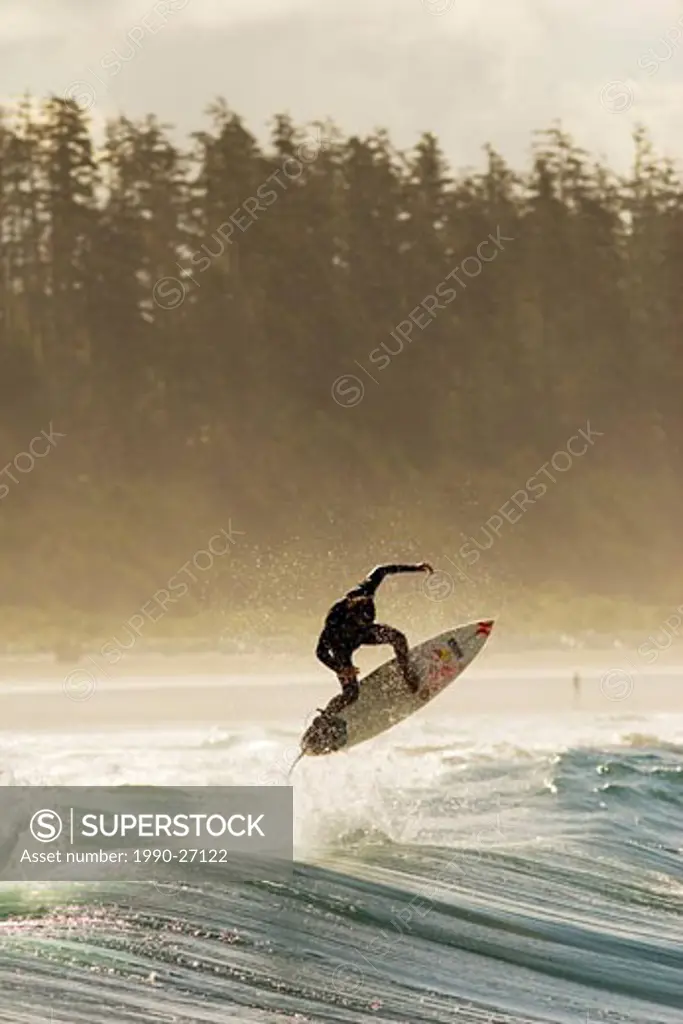 Surfer doing an alleyoop at Long Beach near Tofino, Vancouver Island, British Columbia, Canada