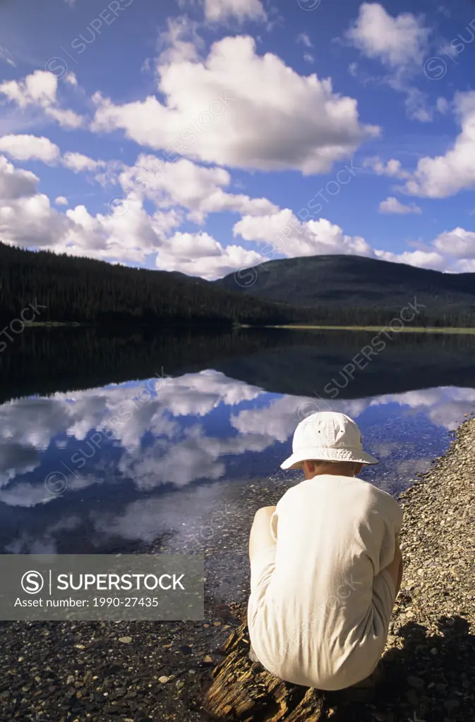 Child searches for Gold along Gold Rush Trail near Barkerville, British Columbia, Canada