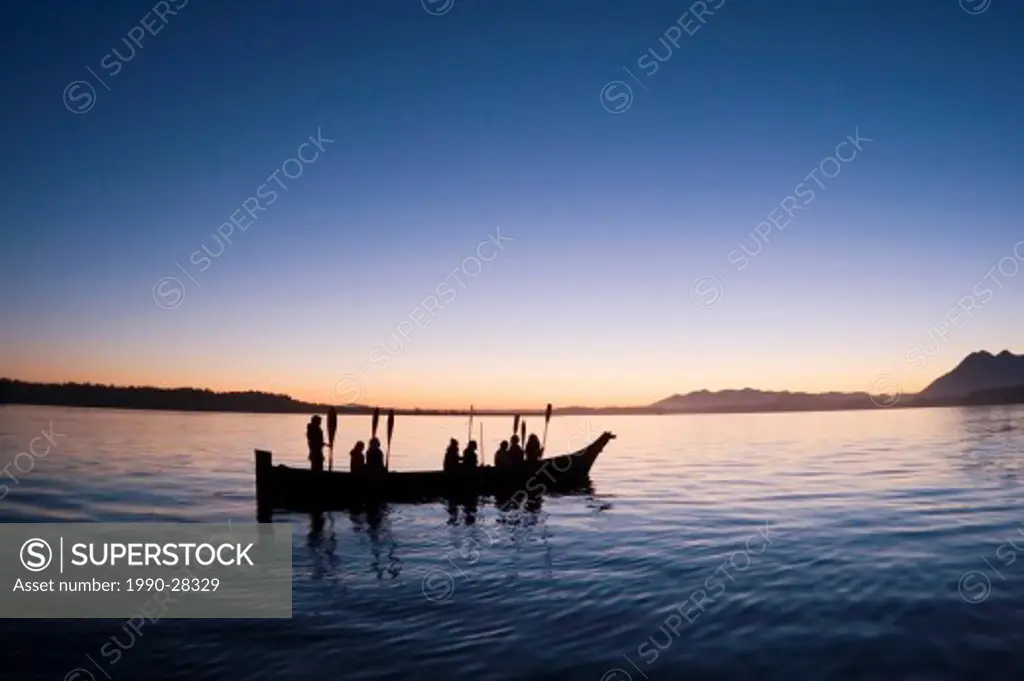 People from Opitsat at dusk in a traditional dugout, Vancouver Island, British Columbia, Canada