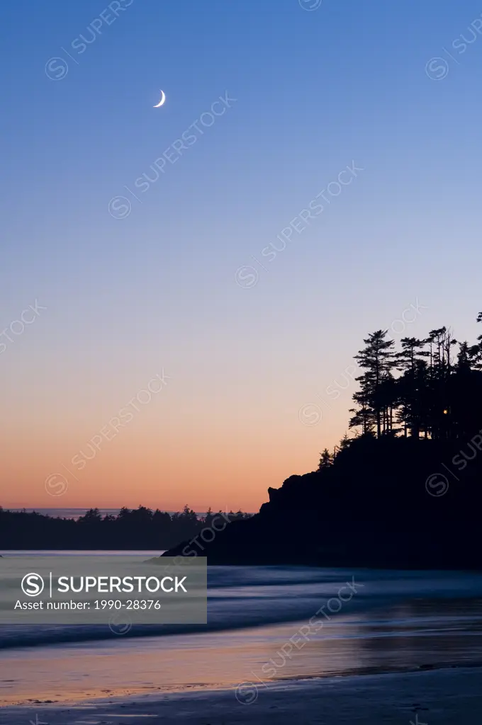 twilight reflects on wet sand, MacKenzie Beach at Tofino, Vancouver Island, British Columbia, Canada