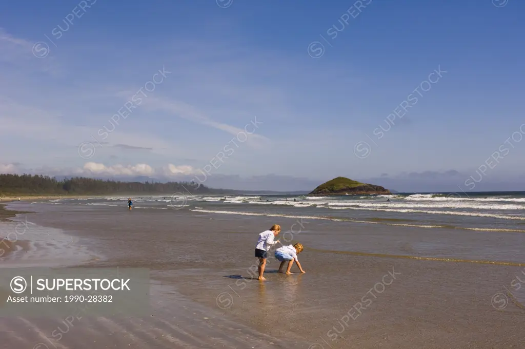 girls play on sand, Pacific Rim National Park, Long Beach, Vancouver Island, British Columbia, Canada
