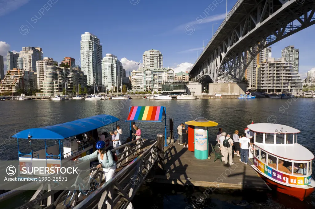Brightly colored water taxis on False Creek, Vancouver, British Columbia, Canada