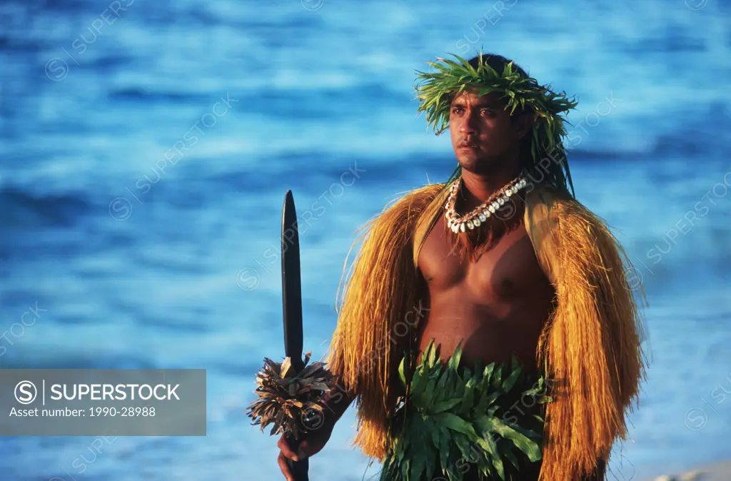 Cook Islands, South Pacific, Raratonga, local dancer in traditional outfit on beach