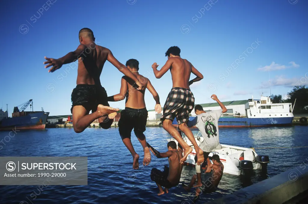 Cook Islands, South Pacific, Raratonga, local teens jump into harbour