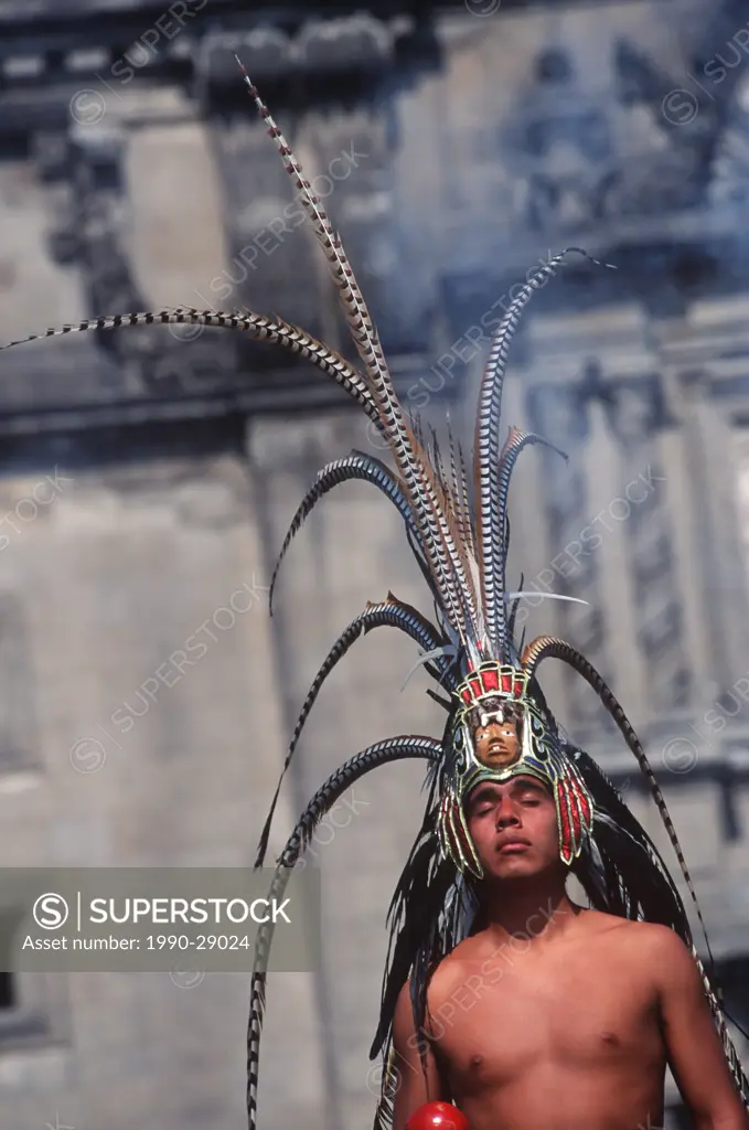 Mexico City, Zocalo, traditional aztec dancer at Metropolitan Cathedral