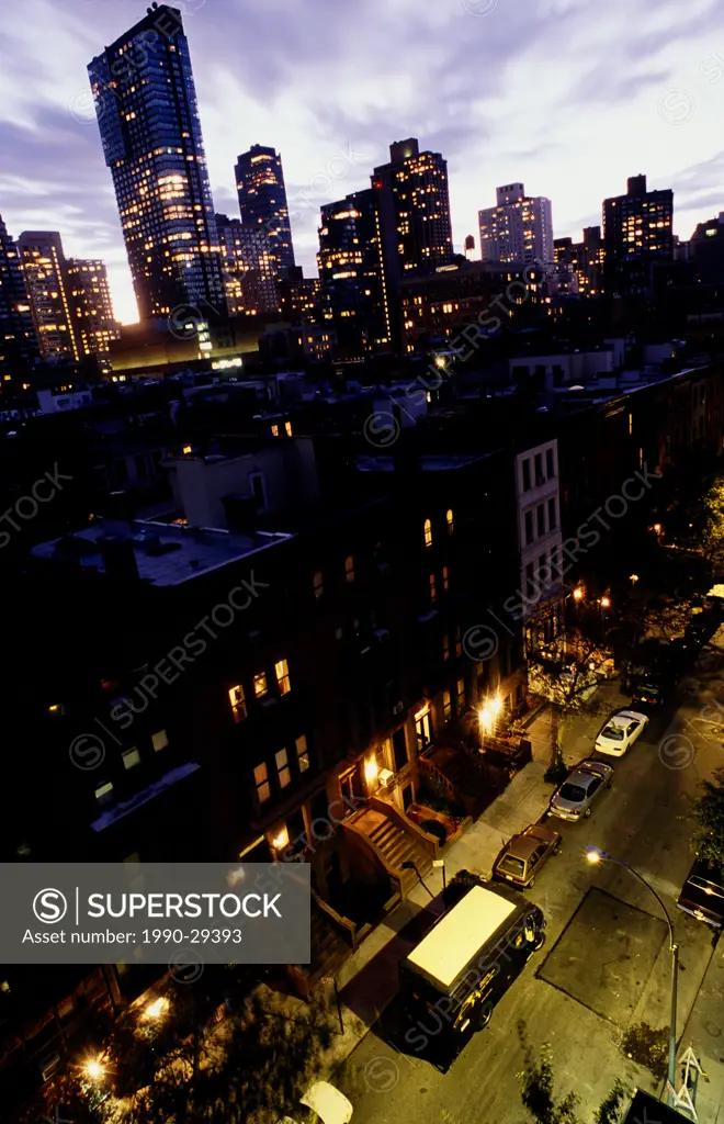 View of brownstone buildings and downtown, near Central Park, New York, NY, USA