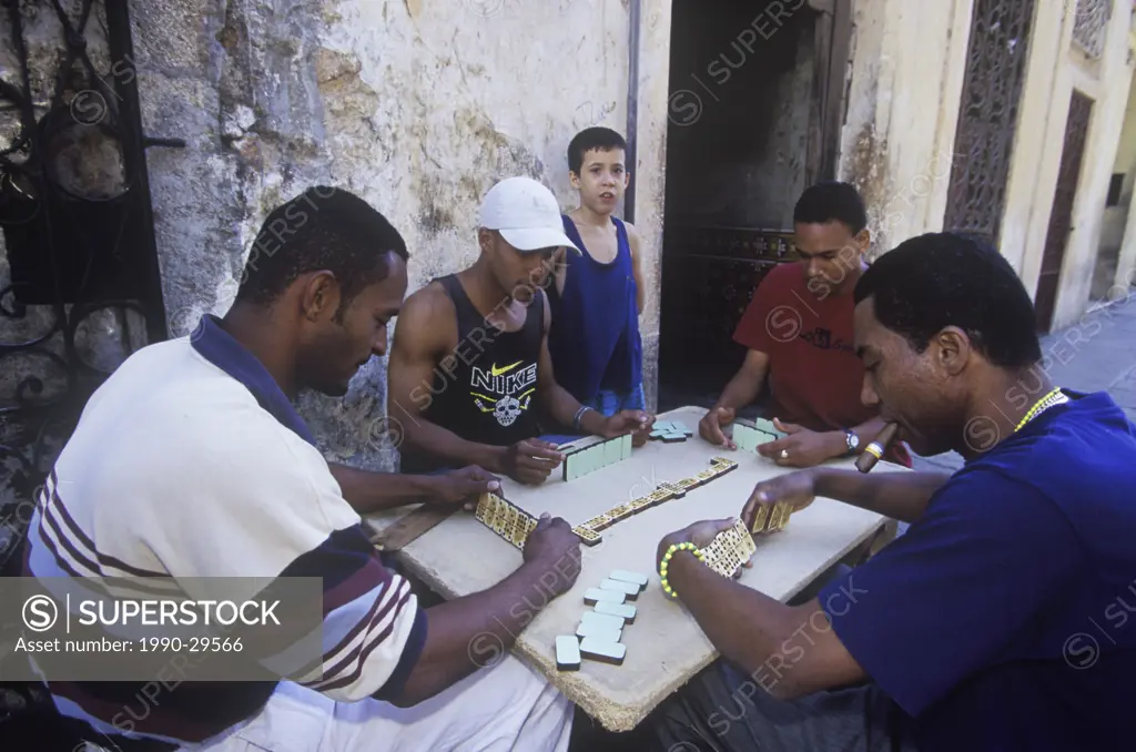 Men playing dominoes on the street.