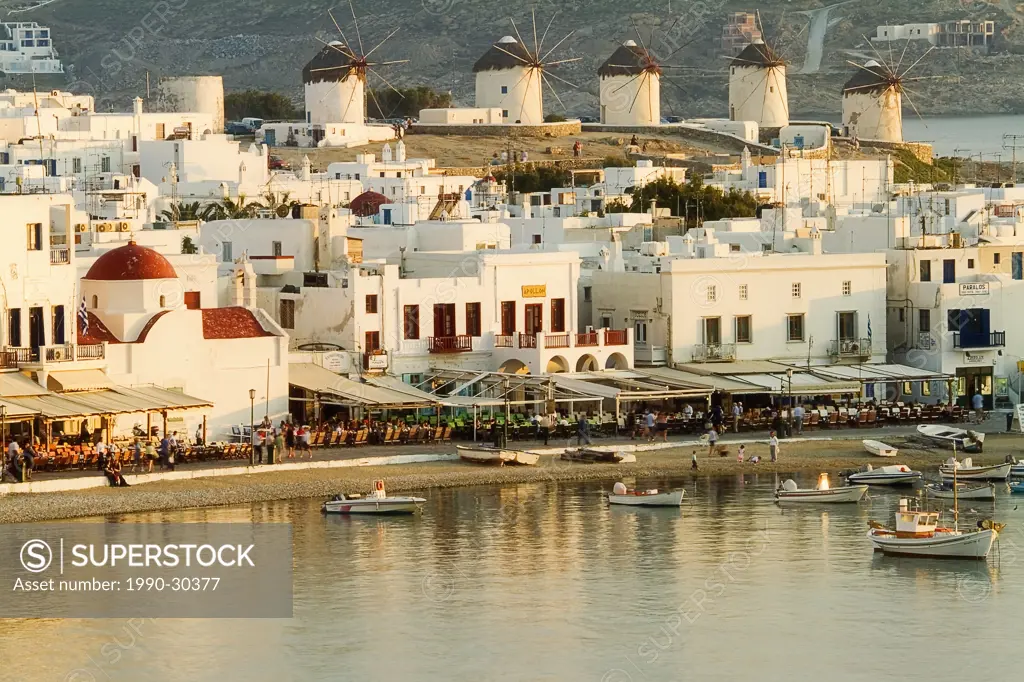 Overview of Town and Harbor at sunset, Aegean Sea, Mykonos Town, Mykonos, Cyclades Islands, Greece.