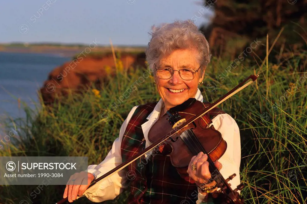 Woman playing the fiddle, Prince Edward Island, Canada