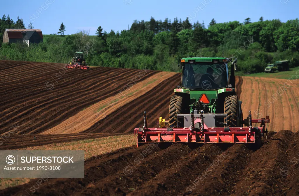 Ploughing potato fields, French River, Prince Edward Island, Canada