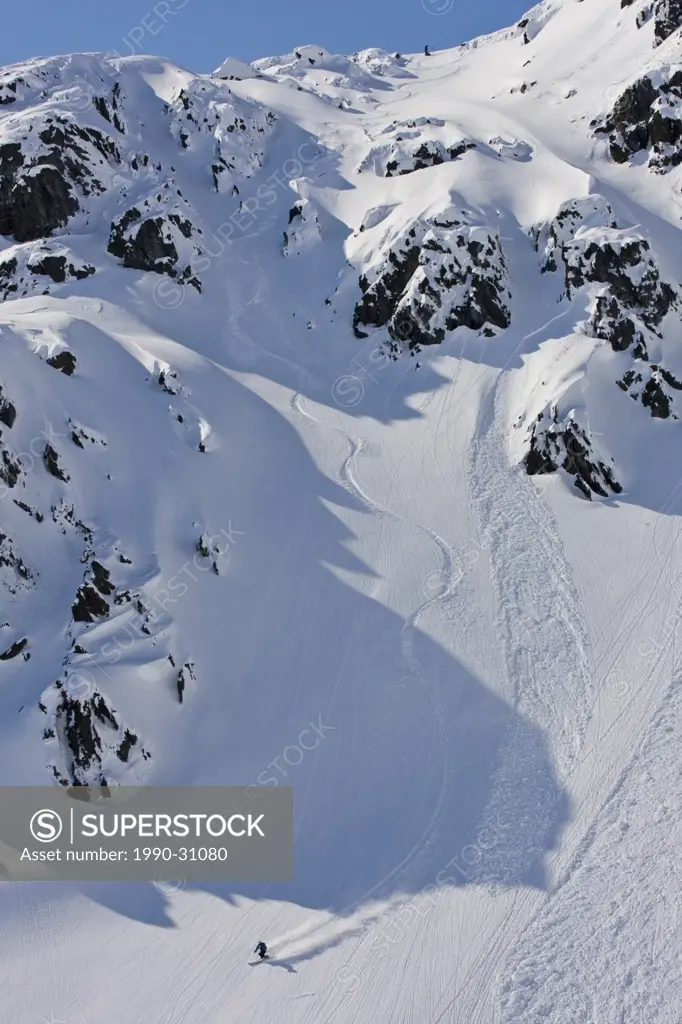 A skier making turns down from Thompson Pass, Valdez, Alaska, USA