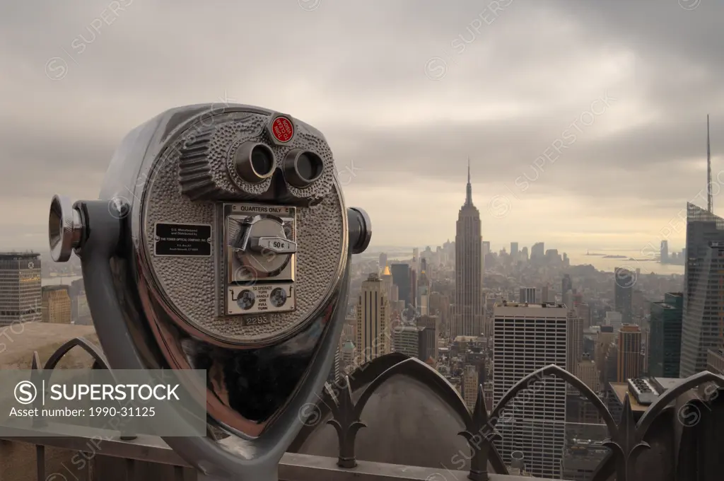 Viewfinder binoculars with the New York skyline in the background at the Top of the Rock lookout, New York City, NY, USA