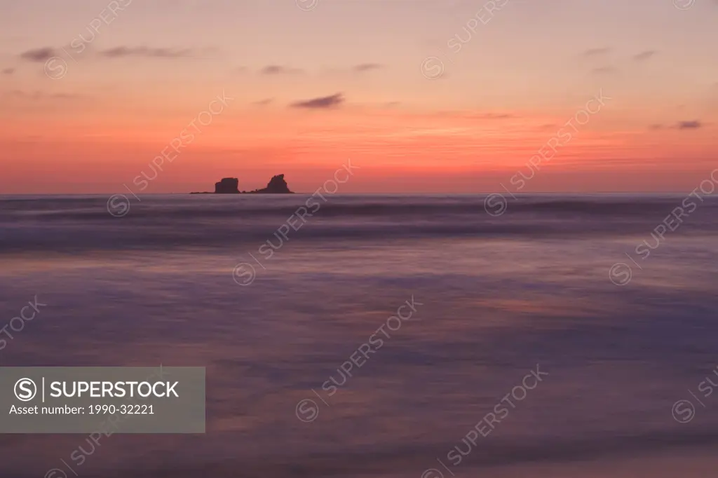The sun sets over the Pacific Ocean along the coast of central Ecuador.