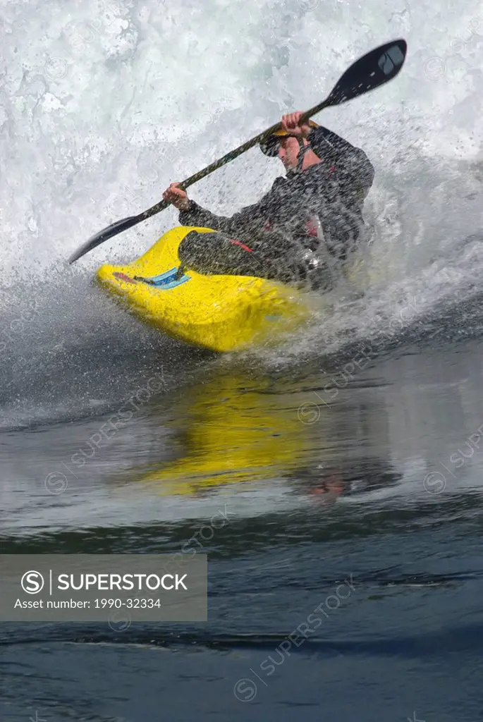 A kayaker plays in the standing waves in Skookumchuck Narrows at Sechelt Inlet BC Canada