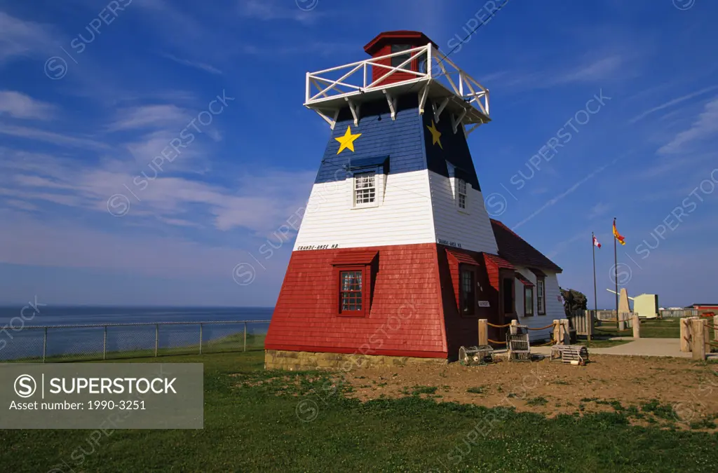 Lighthouse painted like Acadian flag, Grande-Anse, New Brunswick, Canada