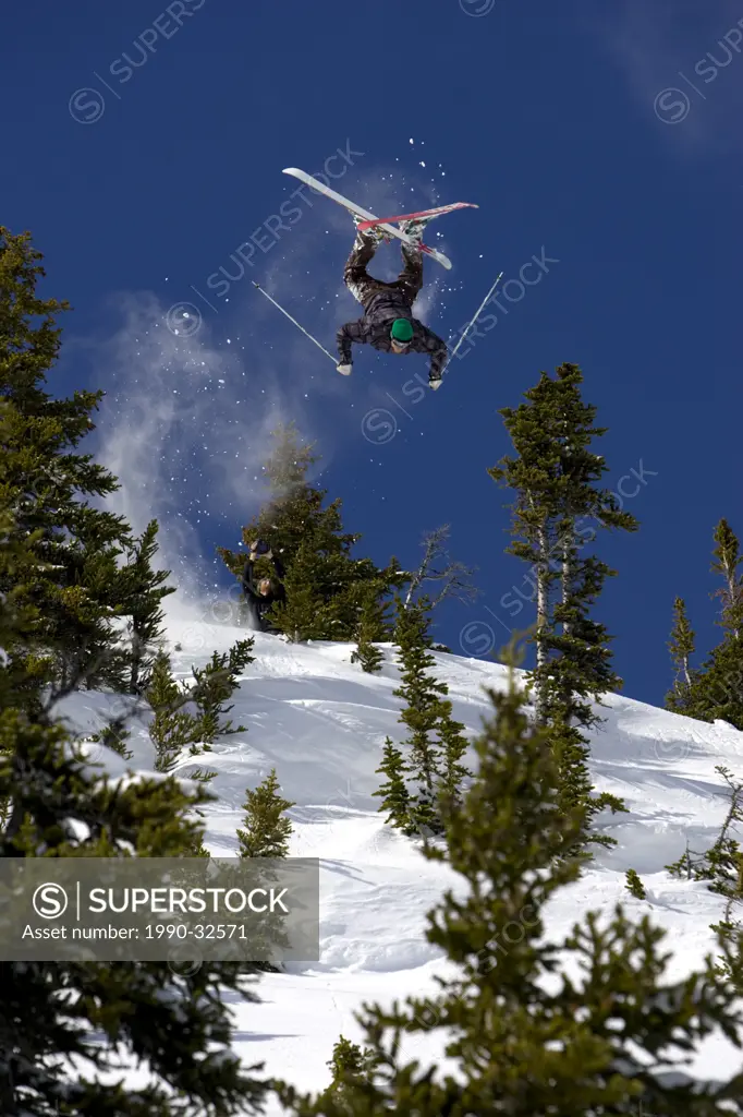 skier flips off cliff, Whistler, BC, Canada