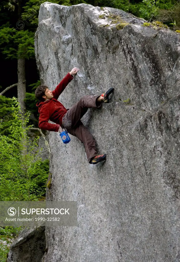 climbing on boulder, Whistler, BC, Canada