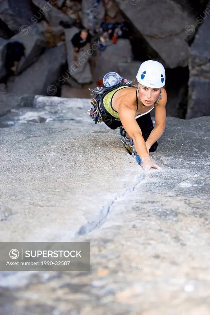 girl climbing a steep crack in Squamish, near Whistler, BC, Canada