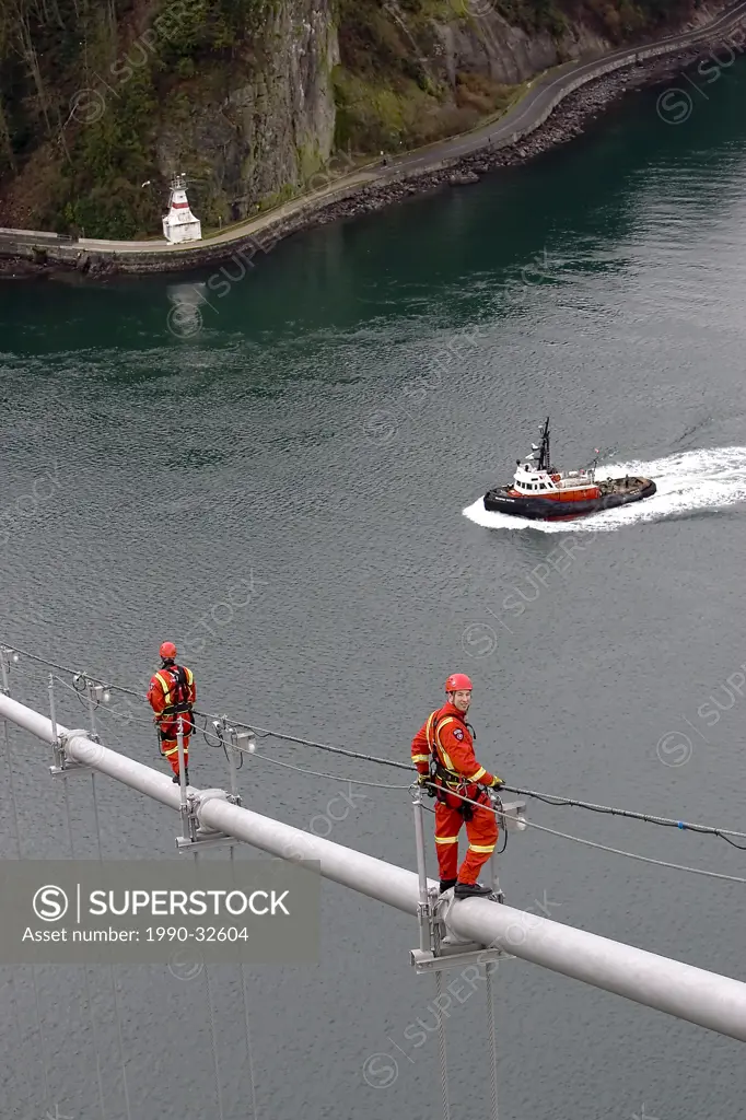 Emergency workers practise on supports of Lions Gate Bridge, Vancouver, BC , Canada