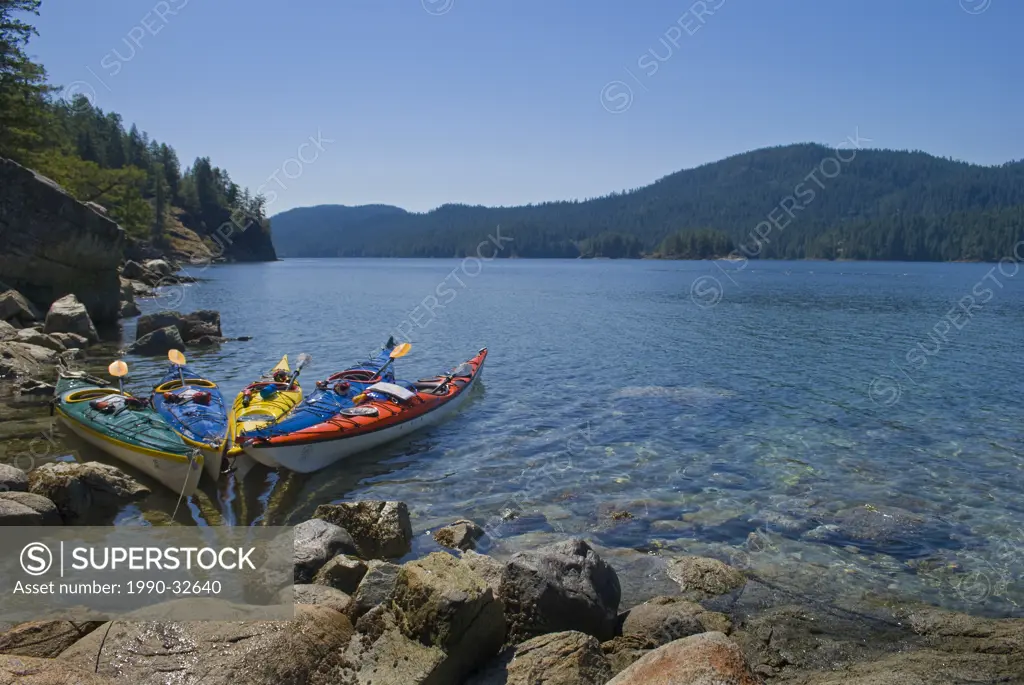 Kayaks docked on the shores of The Aquarium, in the heart of Desolation Sound near Powell River, British Columbia, Canada,