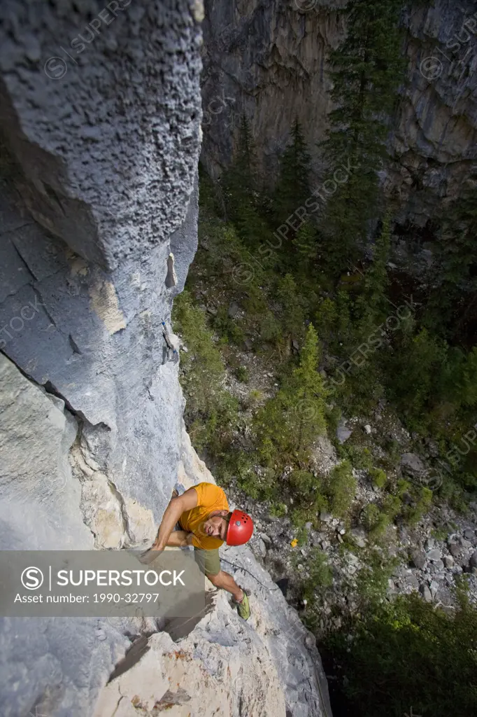 A rockclimber ascends Sister Ray 5.10c, Black Feather Canyon, Banff National Park, AB