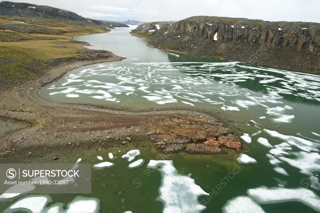 Melting ice in the Arctic Ocean with shoreline features, Coronation Gulf, Nunavut